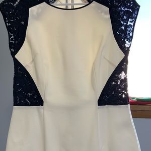 Top- dressy. Stretch cotton and lace small peplum.